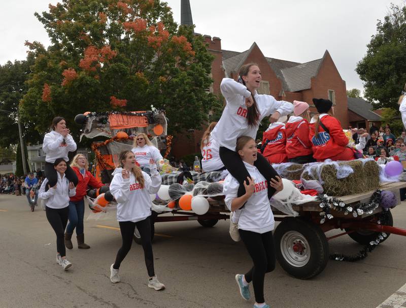 Oregon cheerleaders perform in the Harvest Time Parade, held during Oregon's Autumn on Parade festival on Sunday, Oct. 8, 2023.
