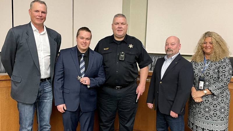 Officer Aaron Riley was sworn-in as the Oswego Police Department's 52nd officer by Village President Troy Parlier, witnessed by Police Chief Jeff Burgner and police commissioners Ron Elvin and Carrie Niesman on Jan. 12, 2023 at Village Hall in Oswego. (from left to right: Parlier, Riley, Burgner, Elvin, Niesman)