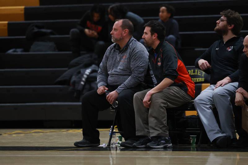 Plainfield East head coach Tony Waznonis (left) watches the game against Joliet West on Thursday, February 2nd.