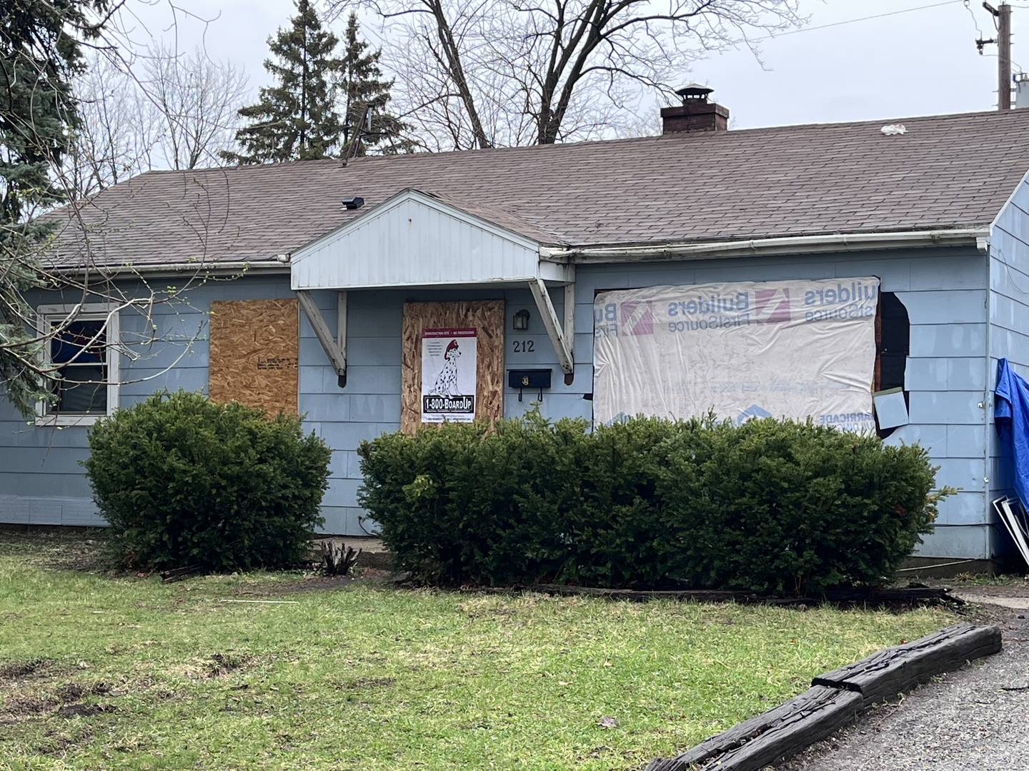 A heavily damaged residence seen on Tuesday, March 31, 2026, on Romayne Avenue in Joliet. An armed man had barricaded himself at the residence, police said.