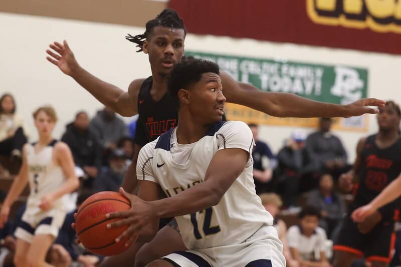 Lemont’s Miles Beachum looks to pass against Romeoville in the WJOL Thanksgiving Classic Championship in Joliet on Saturday.