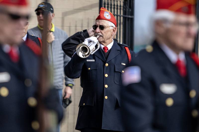 Mike Valtman, of the Abraham Lincoln National Cemetery Memorial Squad, plays taps following the rifle salute during a Veterans Day ceremony at American Legion Post 1080 in Joliet on Nov. 11, 2025.