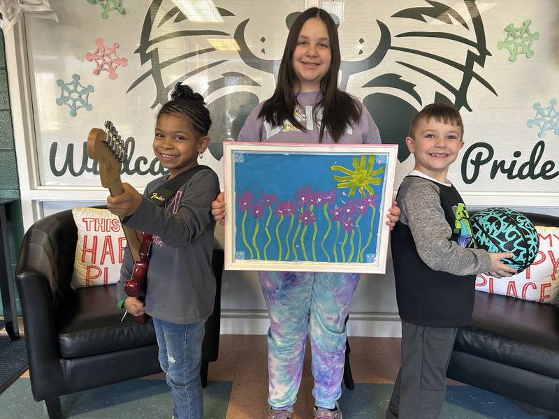 Grand Prairie Elementary School students Ka'niya Caruth (left), Zaley Taylor (middle) and Maximus Murphy (right) are enrolled in the Big Brothers Big Sisters of Will and Grundy County S.O.A.R program and are waiting to be matched with mentors. District 202 in Plainfield and Big Brothers Big Sisters recently partnered for a new program: S.O.A.R. (Skills Opportunities Academics Relationships), which gives mentors and mentees the opportunity to engage in and out of the mentees’ school.