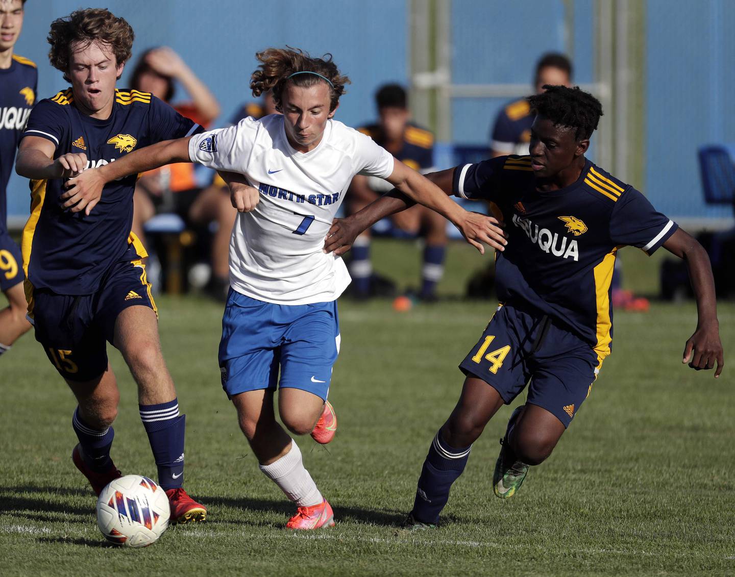 Neuqua Valley's Thomas Melvin (15) and Ayel Kikama (14) try to get to St Charles North's Arnel Dizdarevic (7) Thursday September 8, 2022 in Naperville.
