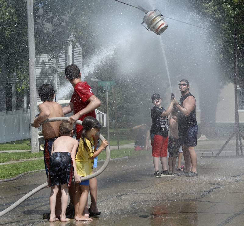 A convenient way to stay cool Saturday, Aug. 19, 2023, while enjoying Grand Ridge’s Community Fest was to participate in the always popular Water Fights on Burlington Avenue.