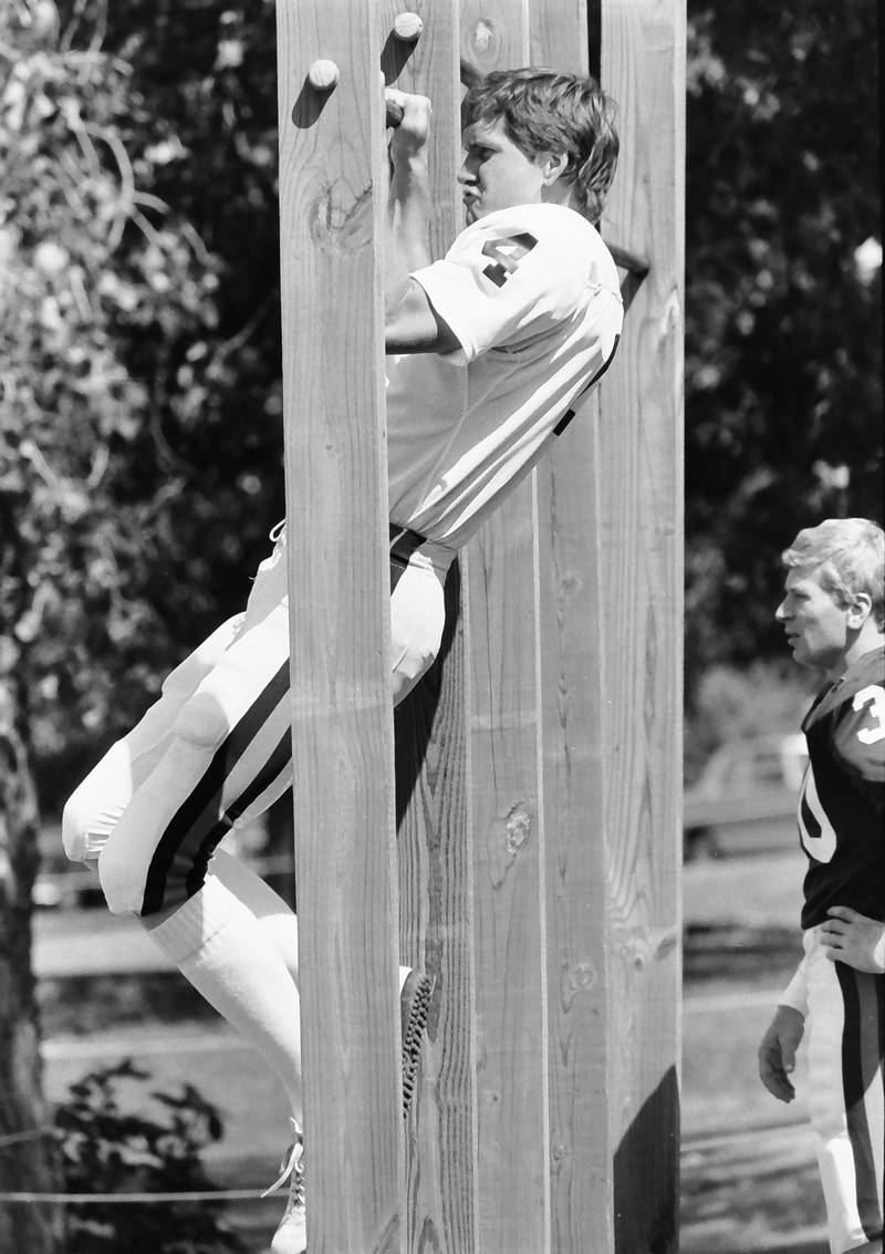 Chicago Bears quarterback Steve Fuller does pull-ups during training camp on Wednesday, June 12, 1985 in Platteville Wis.