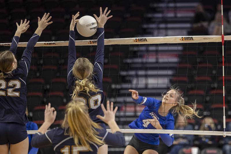 Newman’s Katie Grennan spikes the ball Friday, Nov. 11, 2022 in a class 1A volleyball semifinal against Aquin.