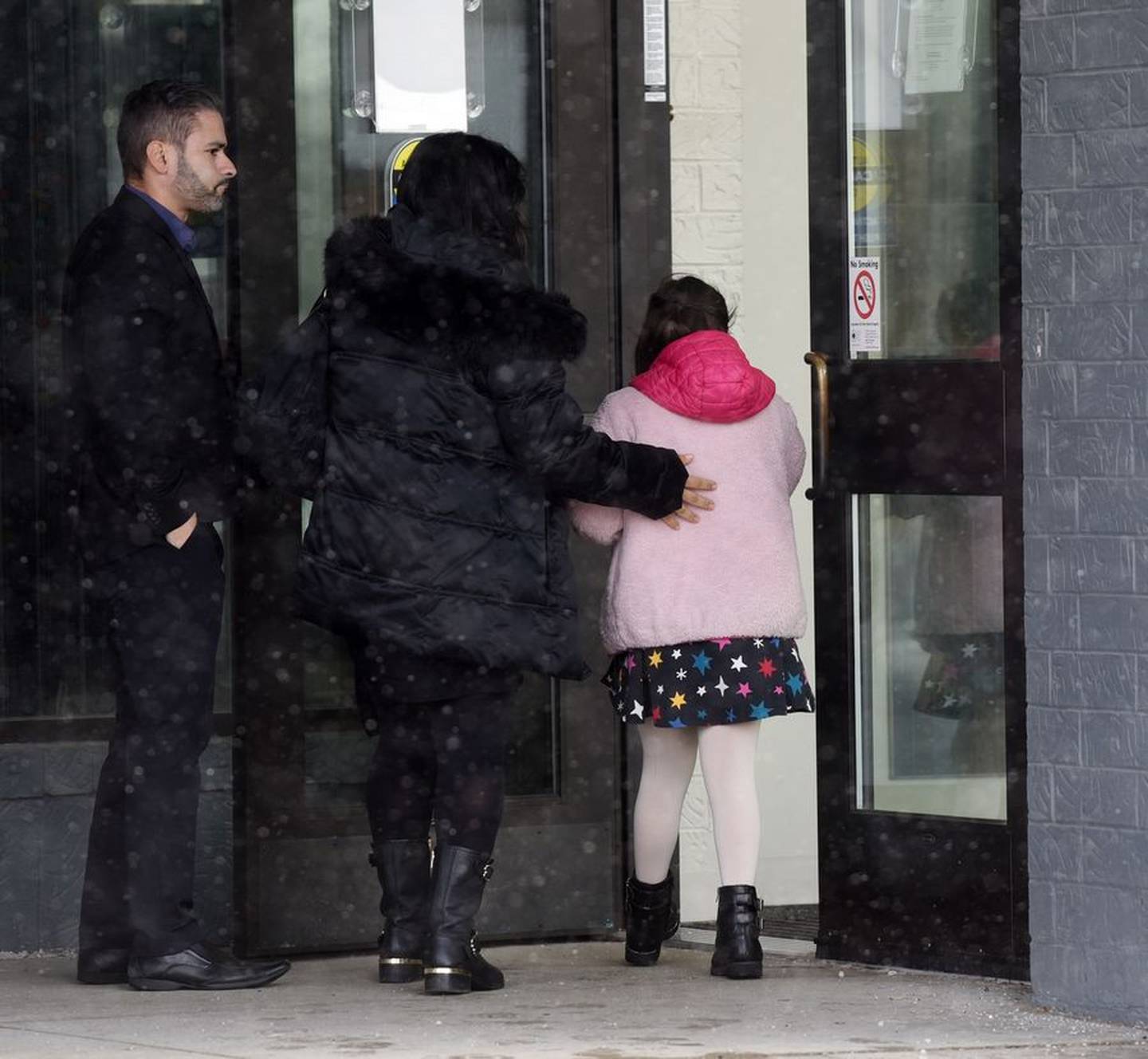 People enter Buffalo Grove's Community Arts Center for the Kisliak memorial service on Friday, Dec. 16, 2022.