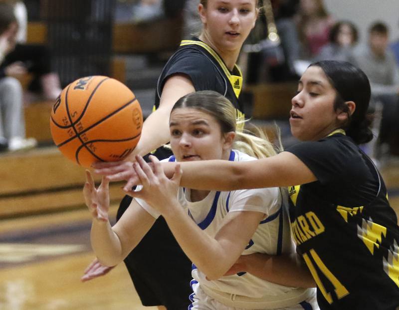Huntley's Anna Campanelli (right) tries to steal there ball from Woodstock's Reese Zawisza during a Kishwaukee River Conference girls basketball game on Monday Jan. 12, 2026, at Woodstock High School.