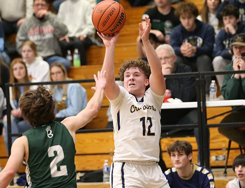 Marquette's Krew Bond shoots a jump shot over St. Bede's Brendan Pillion in the Class 1A Regional semifinal on Wednesday, Feb. 22, 2023 at Midland High School.