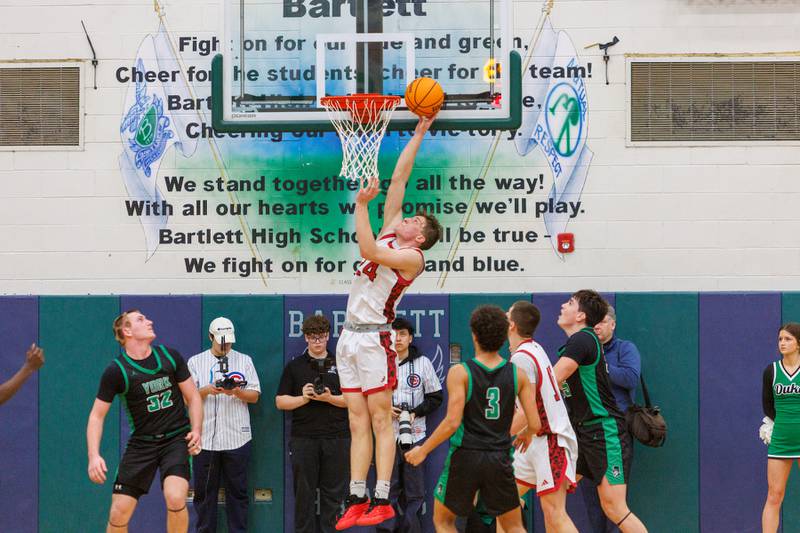 Glenbard East's Sam Walton puts the layup in against York at the Class 4A Bartlett Sectional Final on Friday, March 6,2026 in Bartlett.