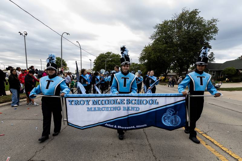 The Troy Middle School Marching Band performs along Glenwood Ave. in Joliet during the Joliet West homecoming parade on Oct. 10, 2025.