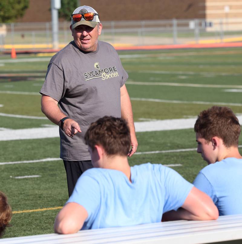 Sycamore boys soccer head coach Kevin Bickley talks to his team Monday, July 14, 2025, before a summer boys soccer friendly at DeKalb High School.