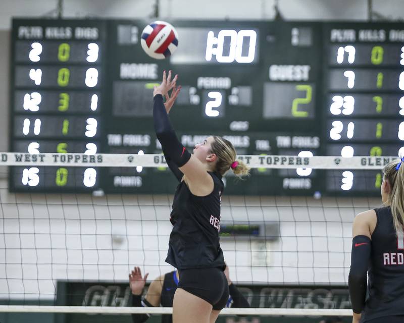 Benet's Ellie Stiernagle (11) sets a shot during Class 4A Glenbard West Sectional final volleyball match between St Charles North at Benet. Nov 6, 2025 in Glen Ellyn.