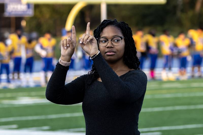 Joliet Central’s Joclynn Stewart performs the National Anthem in ASL before a home football game against Plainfield Central on Sept. 26, 2025.