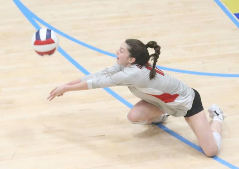 Woodland's Kaiden Connor returns a serve from Marquette on Thursday, Oct. 19, 2023 at Bader Gym.