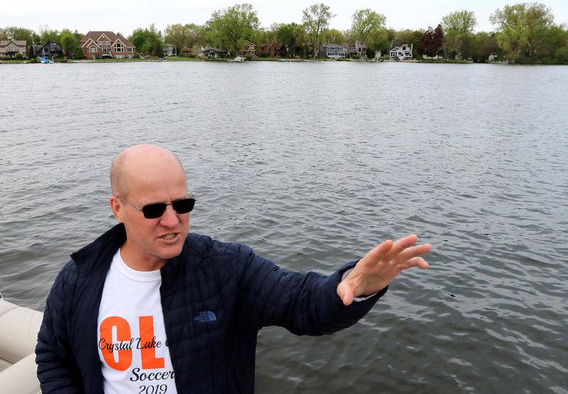 Eric Anderson of Crystal Lake discusses the Crystal Lake shoreline, which the Crystal Lake Parks District is trying to regulate on May 17 in Crystal Lake.