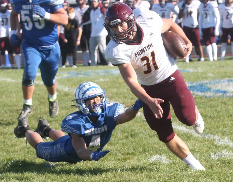 Montini Catholic's Alex Marre avoids a tackle from Princeton's Andrew Peacock on Saturday, Nov. 11, 2023 at Bryant Field in Princeton.