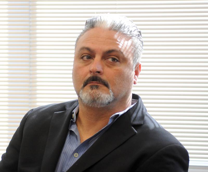 Tony Colatorti listens to proceedings Thursday, April 14, 2022, during a hearing of McHenry County electoral board at the McHenry County Administration Building in Woodstock. The board was to determine if Colatorti can remain on the ballot following an objection by William Brogan and Joel Brumlik over his qualifications to run for the position of McHenry County sheriff.