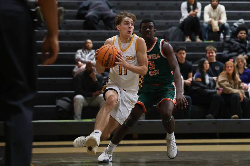 Joliet West’s Luke Grevengoed makes a move along the baseline against Plainfield East on Friday, Dec. 19, 2025 in Joliet.
