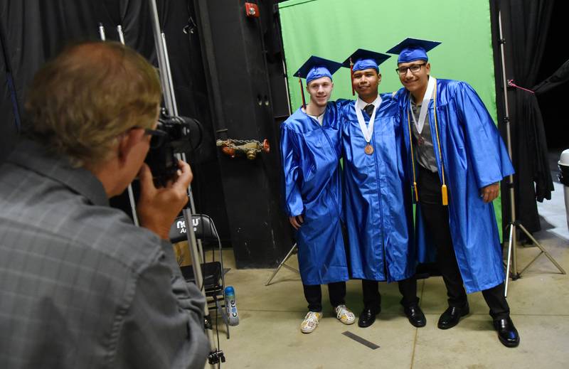 Dundee-Crown High School seniors from left Niccoles Del Genio, Aljendro Lira and Omero Cornejo have their photo taken before the graduation ceremony on Saturday, May 21 at the Now Arena in Hoffman Estates.