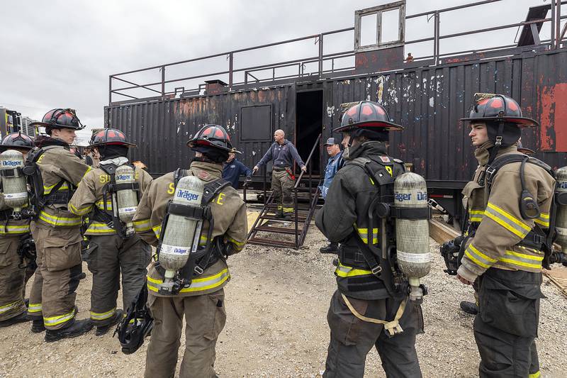 Firefighter Nick Dinges speaks to a group of cadets Saturday, March 15, 2025, about the training plans for the day.
