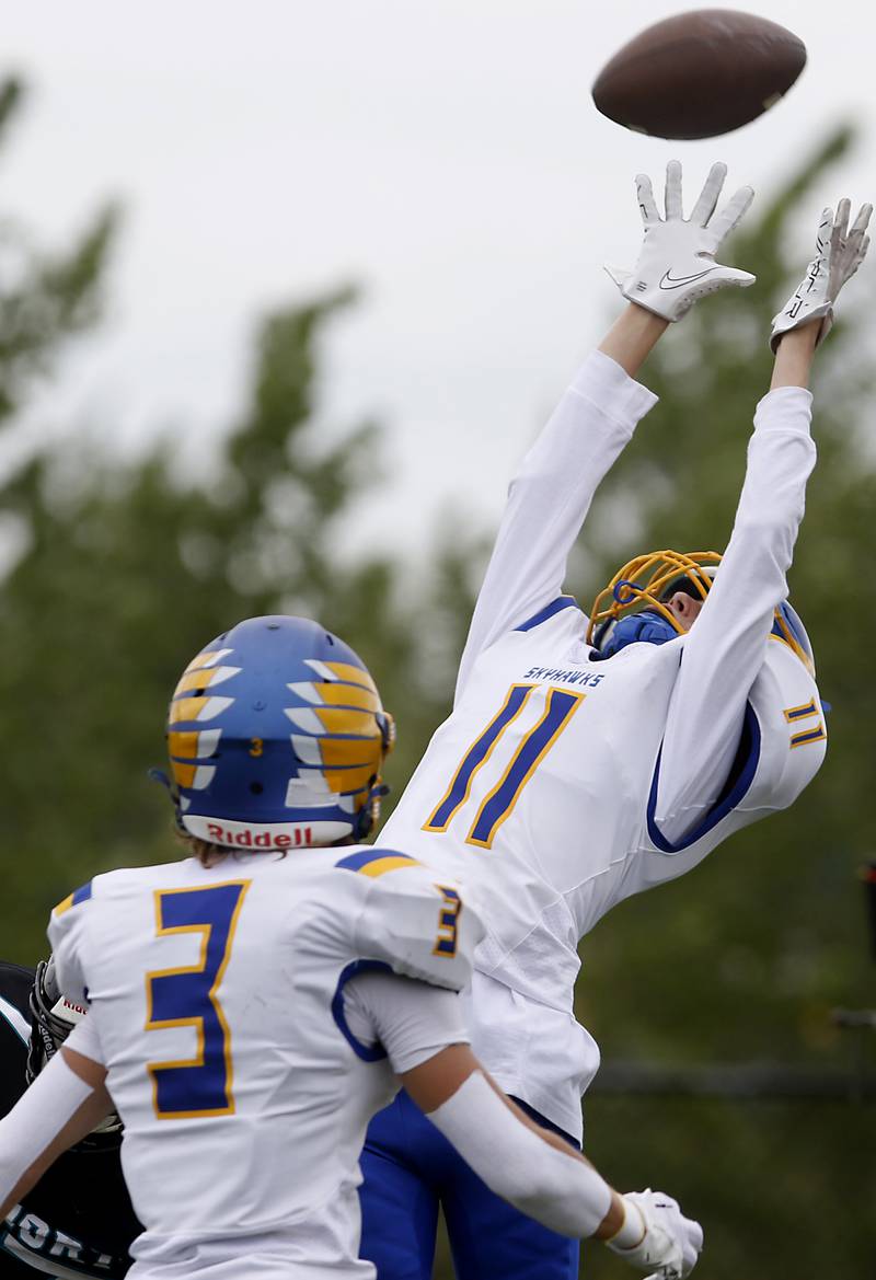 Woodstock North's Parker Menzel tries to catch the ball in the end zone during a Kishwaukee River Conference football game against Woodstock North Saturday, Aug. 26, 2023, at Woodstock North High School.