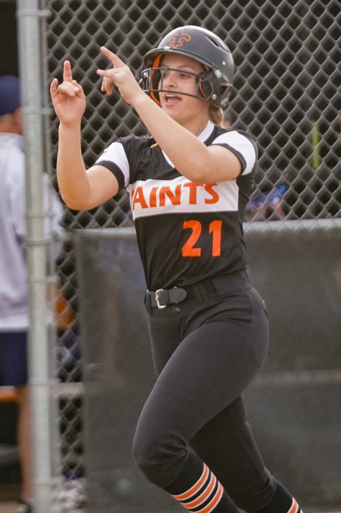 St. Charles East's Hayden Sujack (21) rounds third after hitting a two run homer against Downers Grove South during a softball game at St. Charles East High School on Wednesday, April 10, 2024.