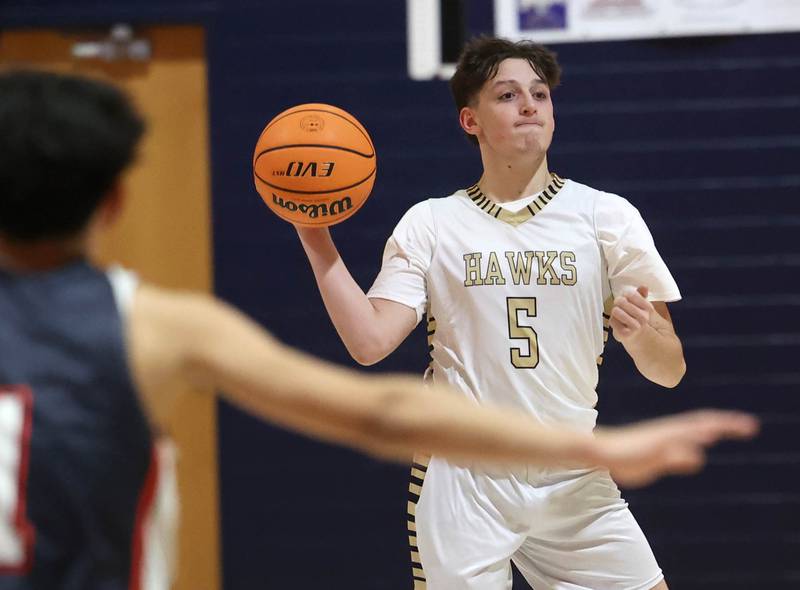 Hiawatha’s Colby Wylde passes the ball as he brings it upcourt against DePue during their game Tuesday, Jan. 20, 2026, at Hiawatha High School in Kirkland.