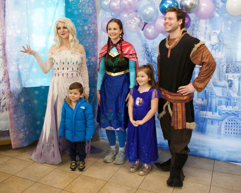 Elsa, Anna, and Kristoff pose for a picture at Frozen Fest at Maryknoll Park on Saturday, Jan. 11, 2025 in Glen Ellyn.