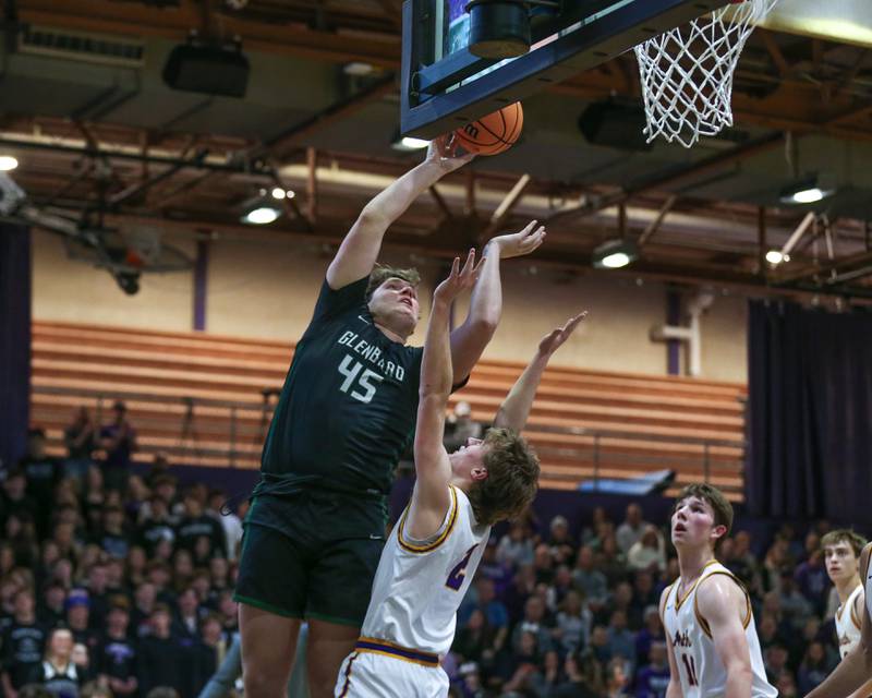 Glenbard West's Mike O'Connell (45) puts in a layup during their basketball game between Glenbard West at Downers Grove North. Jan 24, 2025 in Downers Grove.