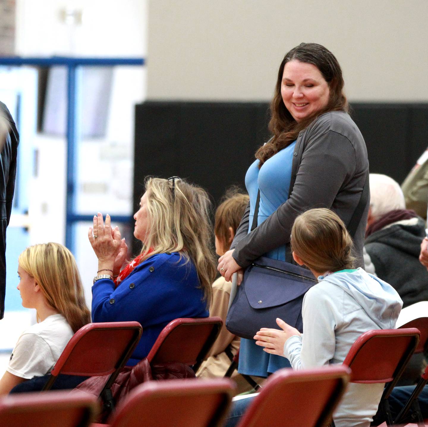 Shannan Harley, an Army veteran, smiles at her daughter, Thompson Middle School seventh grader Jamie Harley during a ceremony honoring veterans at the St. Charles school on Friday, Nov. 10, 2023.