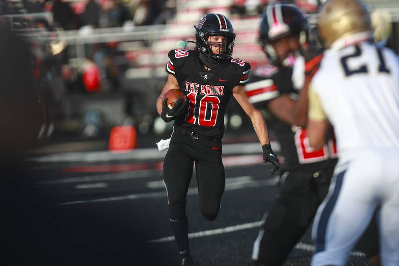 Bolingbrook receiver Alex Tran rushes out of the backfield on Friday, April 16, 2021, at Bolingbrook High School in Bolingbrook, Ill.