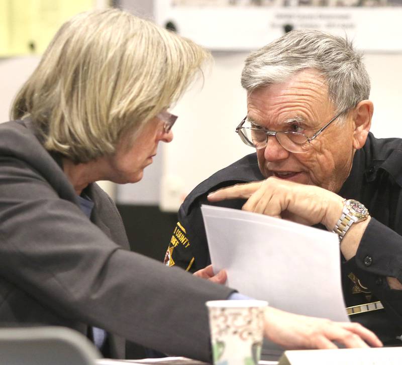 DeKalb County Chief of Corrections Joyce Klein and Sheriff Roger Scott talk Tuesday, during the DeKalb County Public Building Commission meeting in Sycamore.