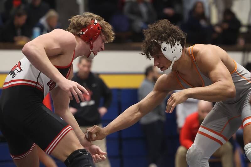 Yorkville’s Luke Look (left) faces Romeoville’s Mason Gougis in the Southwest Prairie Conference 175 pound Championship at Joliet Central on Saturday, Jan. 20th, 2024.