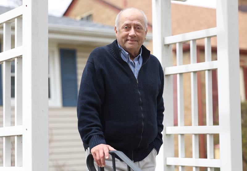 Retired theater director Keith White poses for a photo outside his home in Joliet. Keith was recently awarded the first-ever Dean’s Lifetime Achievement Award for Excellence presented by Lewis University.