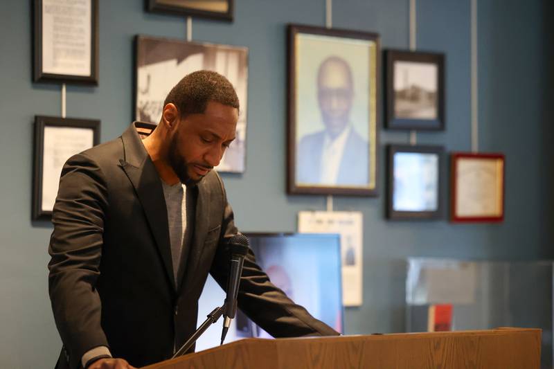 Montele Crawford, pastor at Morning Star Baptist Church in Kankakee, says the opening prayer during the opening of the exhibit 'Called to Kankakee: The Life and Legacy of the Rev. William H. Copeland Jr.' at the Kankakee County Museum on Saturday, Feb. 7, 2026.