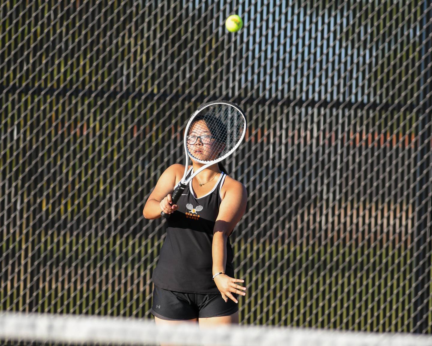 DeKalb’s Jolie Ni serves the ball in the first singles match on Thursday Sept. 25, 2025, while taking on Sycamore held at DeKalb High School.