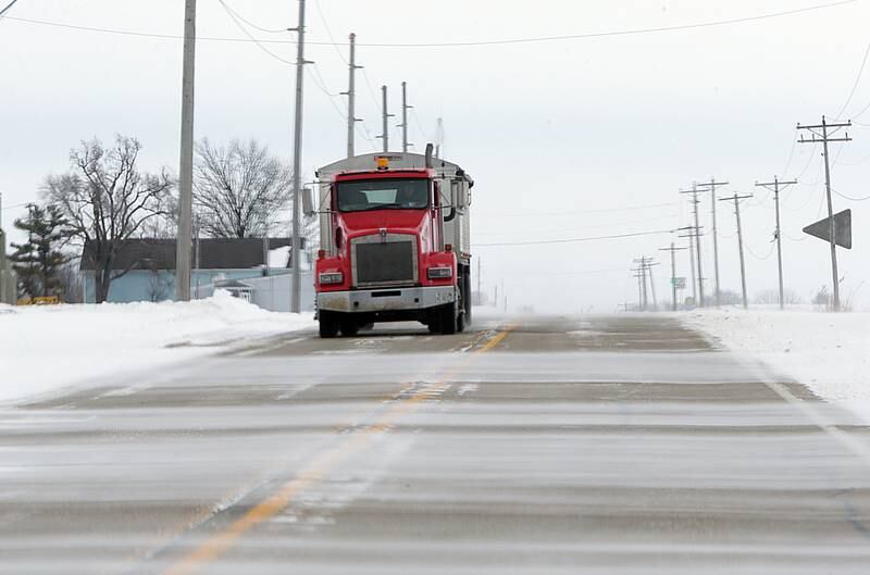 A semi truck passes through blowing and drifting snow on Route 71 near Granville on Thursday, Feb. 3, 2022.