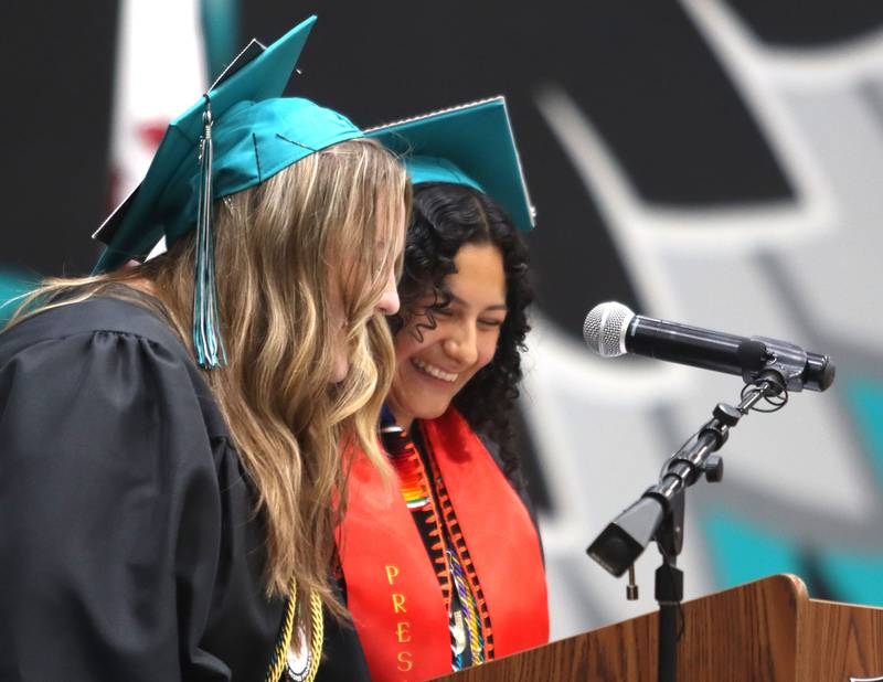 Seniors Samantha Hill and Daisy Garcia make a presentation during graduation at Woodstock North High School in Woodstock on Saturday, May 17, 2025.