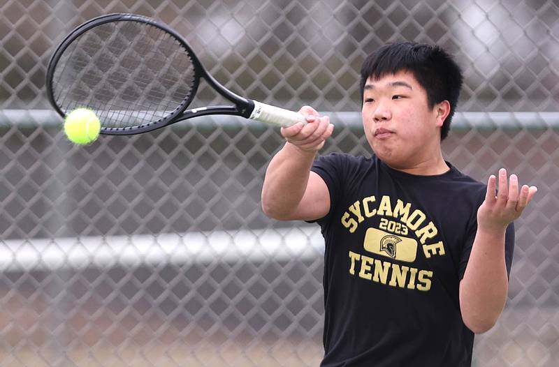 Sycamore’s Regan Ni hits a forehand during his number two singles match against Dixon Thursday, March 30, 2023, at Sycamore High School. This is the inaugural season for the Sycamore boys tennis team.