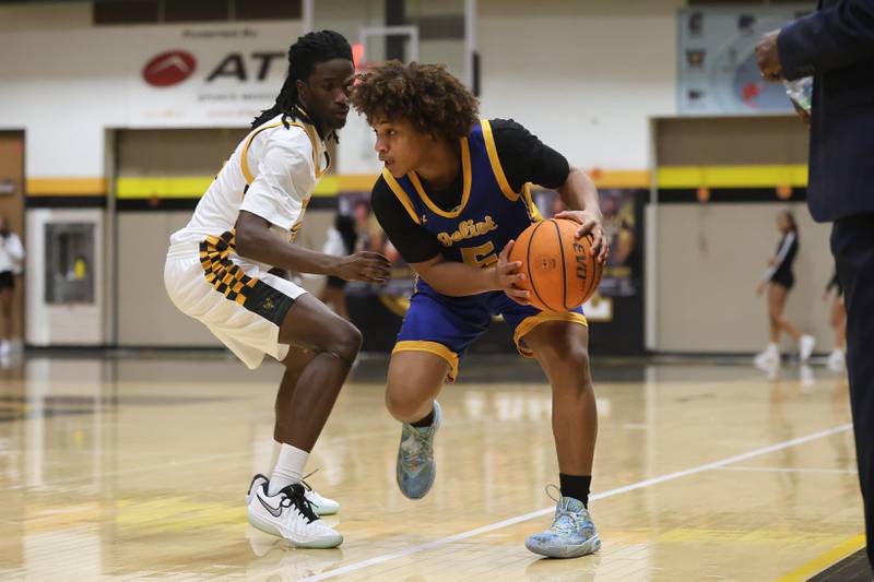 Joliet Central’s Michael Smith works the ball against Joliet West on Tuesday, Feb. 17, 2026 in Joliet.