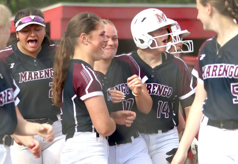 Marengo’s Indians get revved up after a Kylee Jensen home run in IHSA Class 2A Sectional Semifinal softball action at Marian Central High School in Woodstock on Thursday, May 29, 2025.