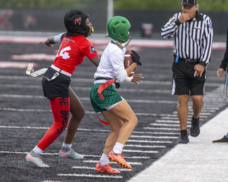 Plainfield Central's Ella Page (1) catches a pass on the sidelines during flag football game between Plainfield Central at Bolingbrook Wednesday, Sept 3, 2025  in Bolingbrook.