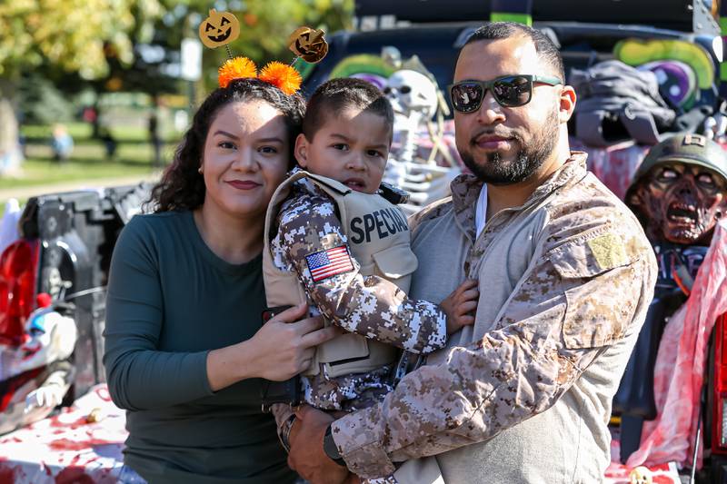 Ricky Robles,who served in the Marines, with his wife Christina and son also named Ricky had a military themed exhibit at the La Grange Trunk or Treat event.  Oct 21, 2023