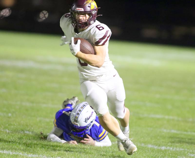 Richmond-Burton’s Hunter Carley breaks a tackle on a long touchdown run in IHSA football Class 3A second-round playoff action at Bob Stewart Field on the campus of Aurora Central Catholic High School in Aurora on Friday, November 7, 2025.