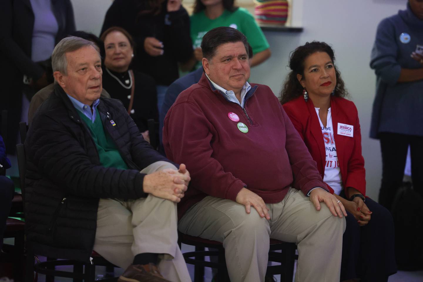 Senator Dick Durbin, left, Governor JB Pritzker and Will County Circuit Judge candidate Jessica Colón-Sayre sit together at the Will County Latinx Day of Action, an effort to talk with and engage with Latinx voters, at El Camaleon Bar and Grlll in Joliet. Saturday, Oct. 1, 2022, in Joliet.