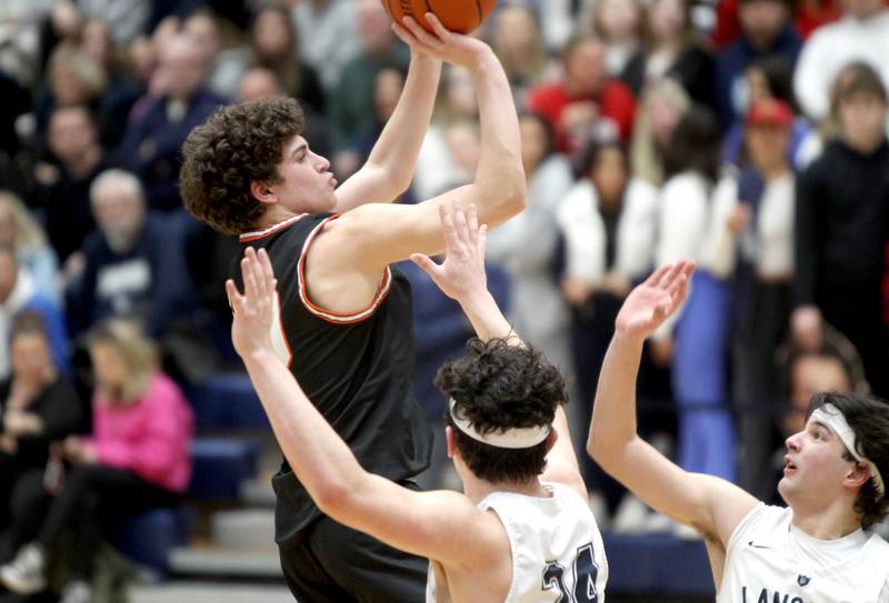 Wheaton Warrenville South’s Luca Carbonaro shoots the ball during a game at Lake Park in Roselle on Friday, Feb. 10, 2023.