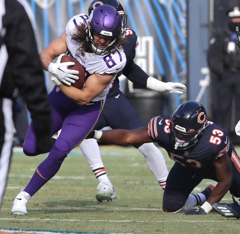 Minnesota Vikings tight end T.J. Hockenson breaks a Chicago Bears linebacker Nicholas Morrow tackle Sunday, Jan. 8, 2023, during their game at Soldier Field in Chicago.