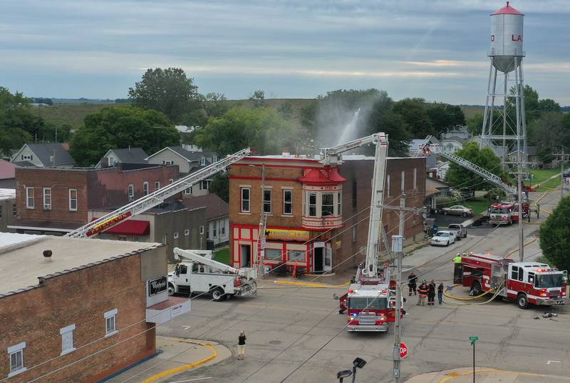 Firefighters work the scene of a structure fire at 201 North Main Street on Monday, Aug. 14, 2023 at Ladd. The fire happened just before 7:30a.m. and was upgraded to a three-alarm fire.  Firefighters from Mendota, Ladd, Peru, La Salle, Utica, Princeton and others helped with the blaze.